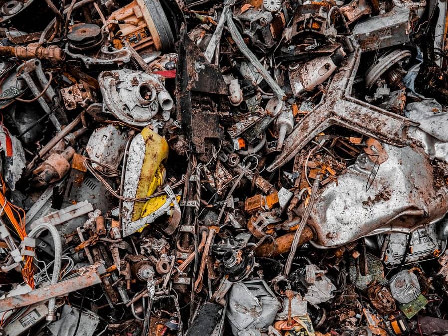 A densely packed heap of mixed scrap metal — motors, appliances and cable